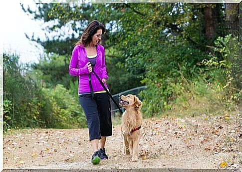 woman walking with her dog